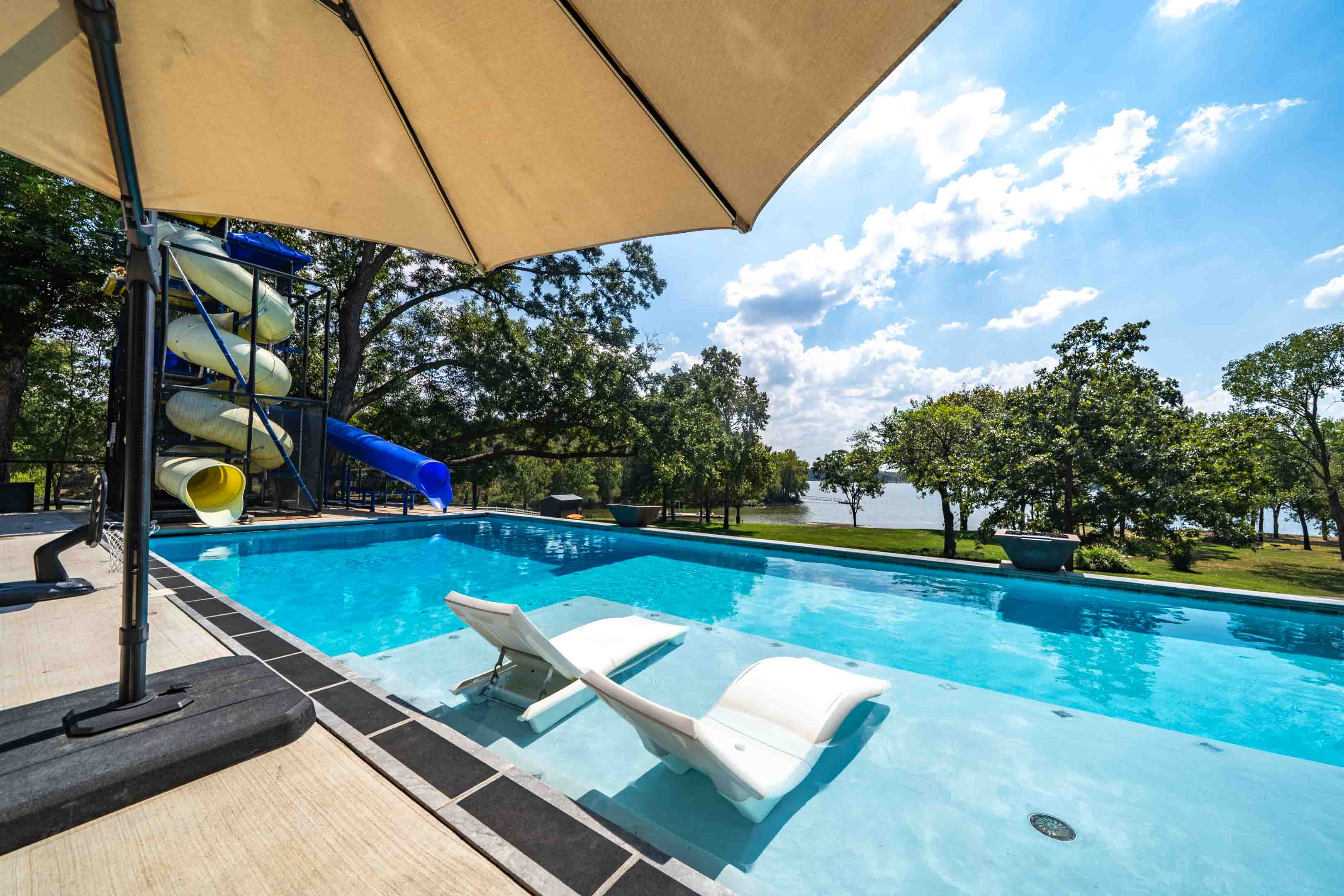 Pool loungers with lake view